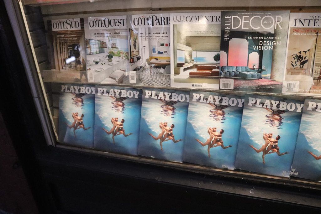 Shelves of colourful print magazines on display inside a specialist magazine shop in New York.